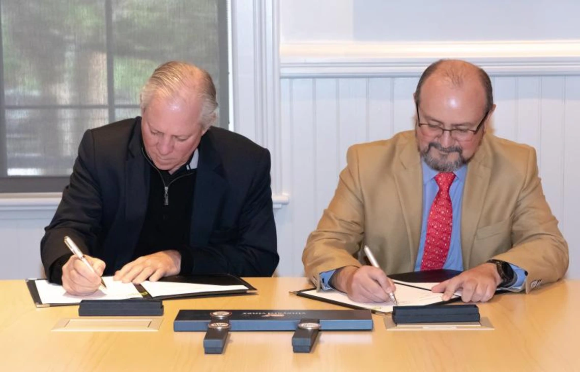Robert Robbins and David Vazquez sign MOU